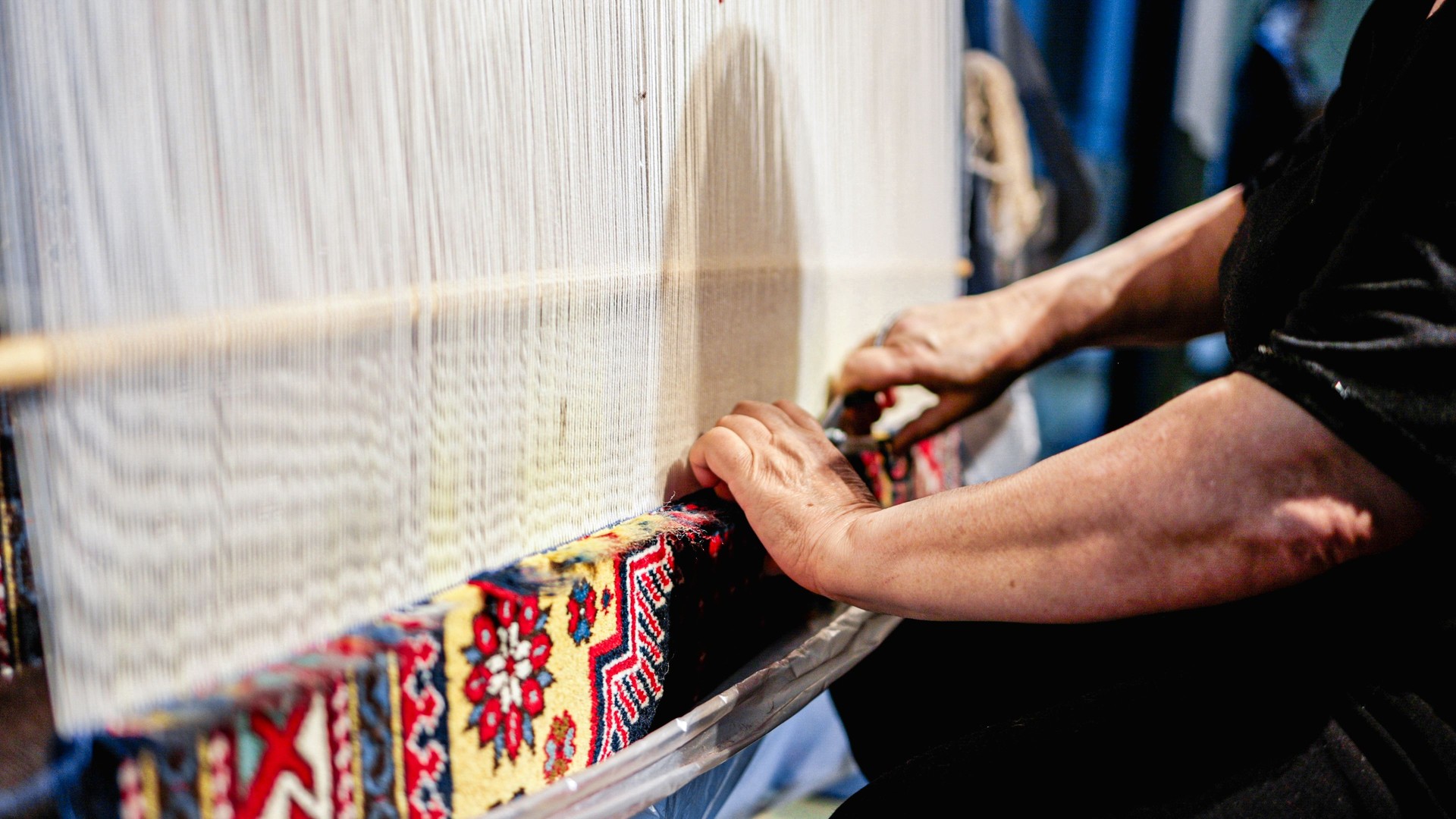 Detailed View of Artisan Weaving Traditional Azerbaijani Carpet, Showcasing Intricate Craftsmanship in Baku